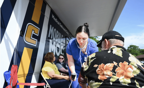 Nursing student Carly Chastain takes a patient’s blood pressure.